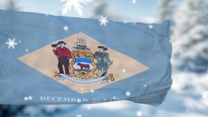 Delaware State flag with Delaware winter snowflakes in the background