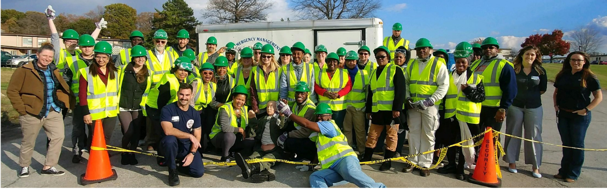 Community Emergency Response Team - Photo of team members meeting at a training event.
